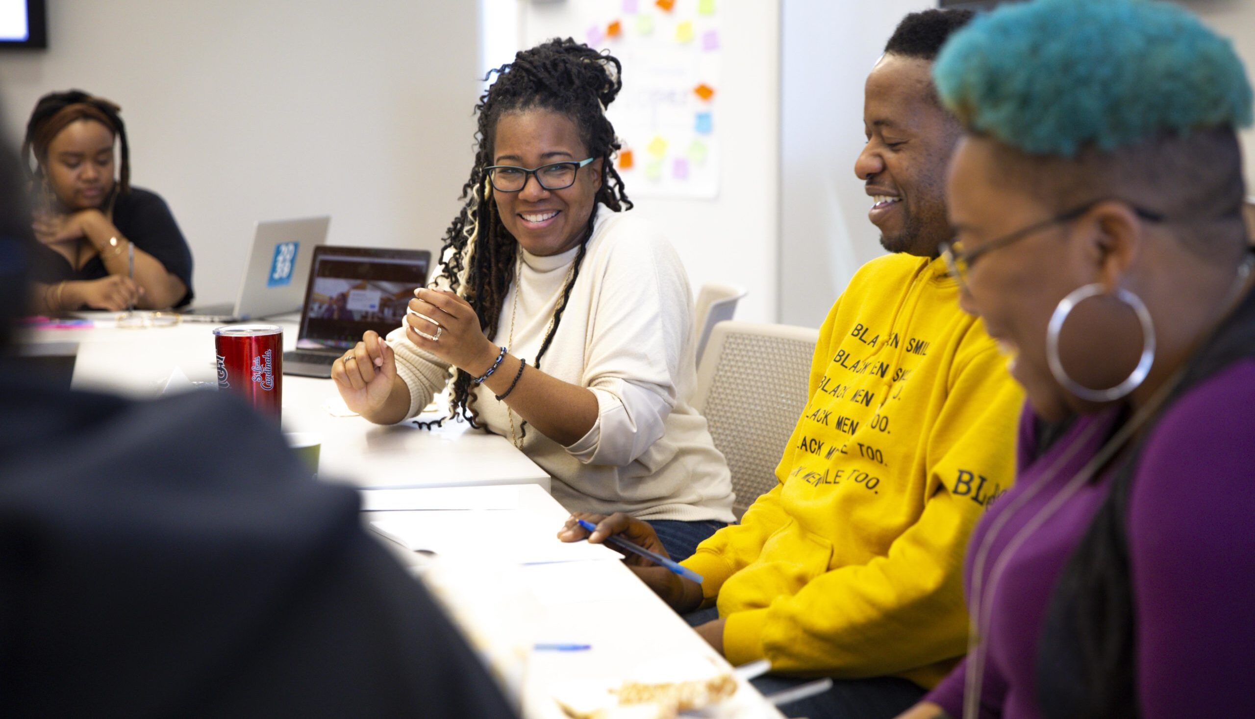 Community Governance Board members discussing and laughing
