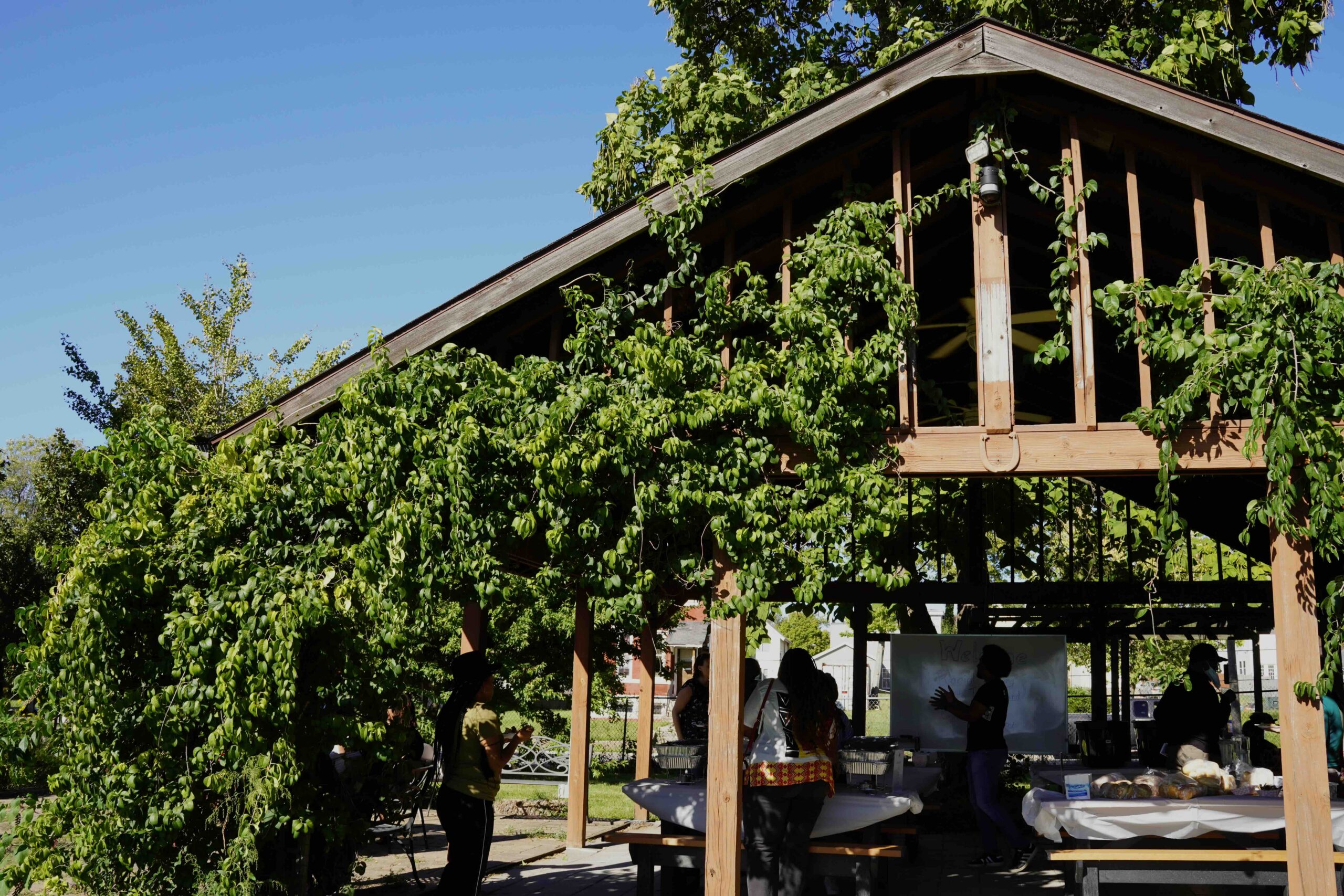 A sunny gazebo in the Deaconess Foundation garden where members of the Racial Healing + Justice Fund Community Governance board and Forward Through Ferguson staff are gathering.